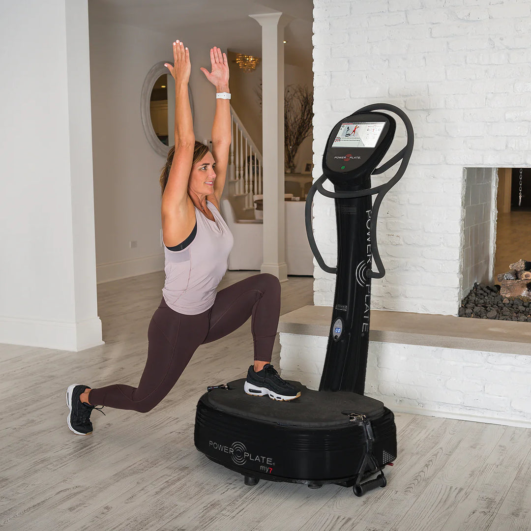 Woman using Black Power Plate® my7™  in a home setting