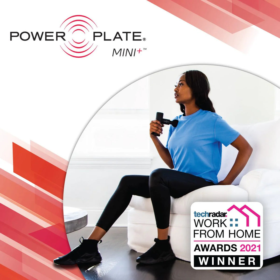 Woman using Power Plate Mini+ device with award badge on a white background